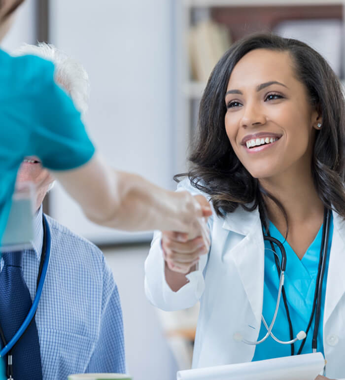 Confident doctor interviews nurse